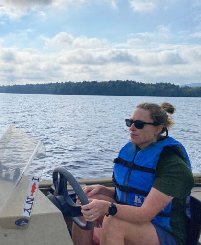 Ecologist in boat on water