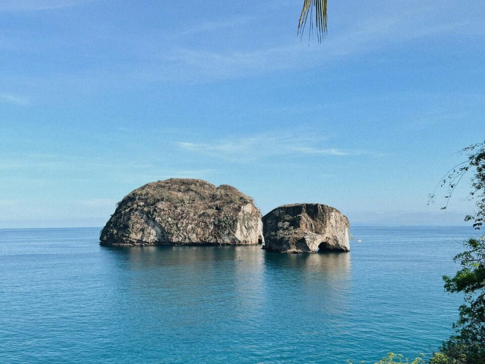 Image of Mismaloya Arches in Mexico surround by a body of open ocean.